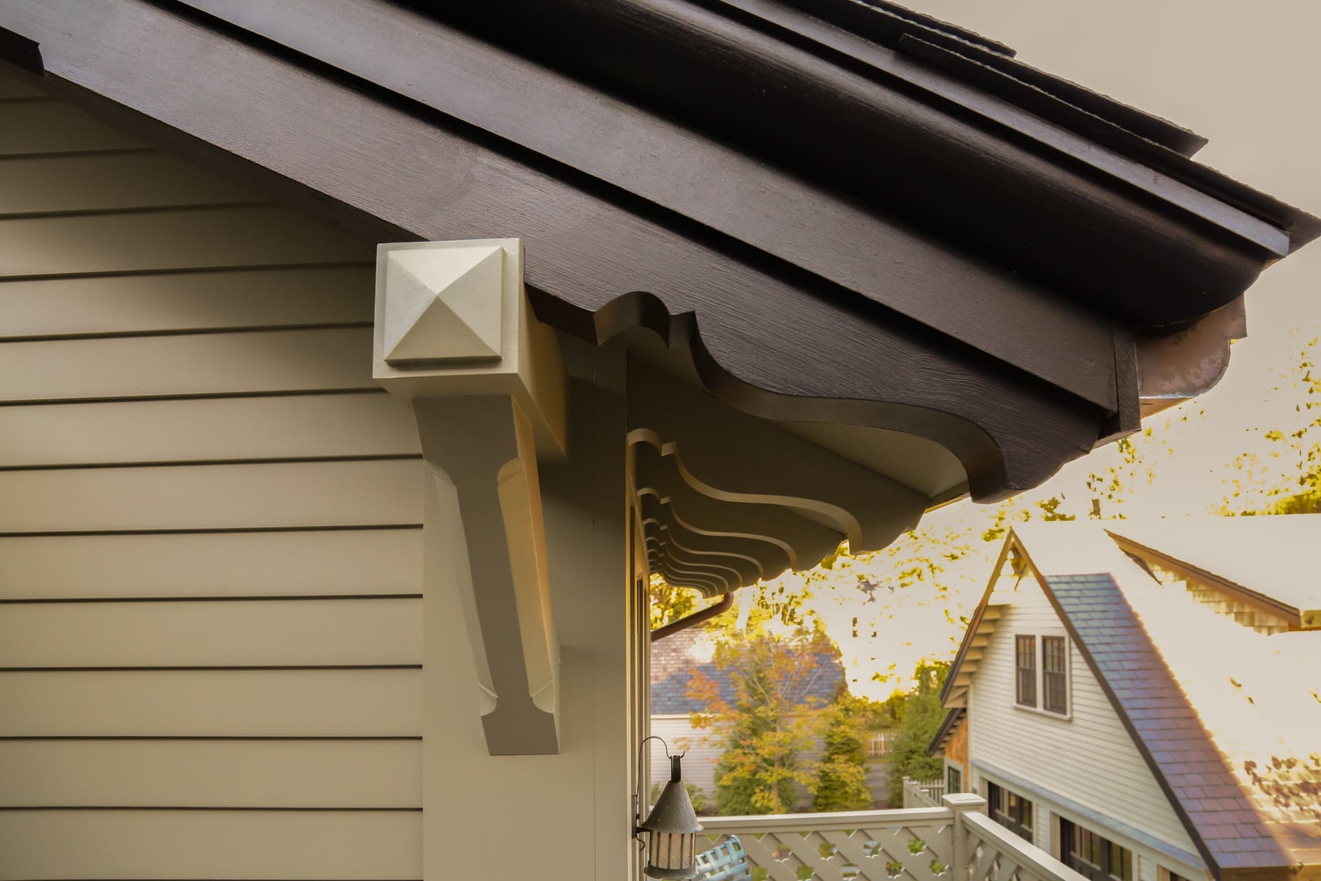 A photo of grey-green painted roof eaves and bracket.