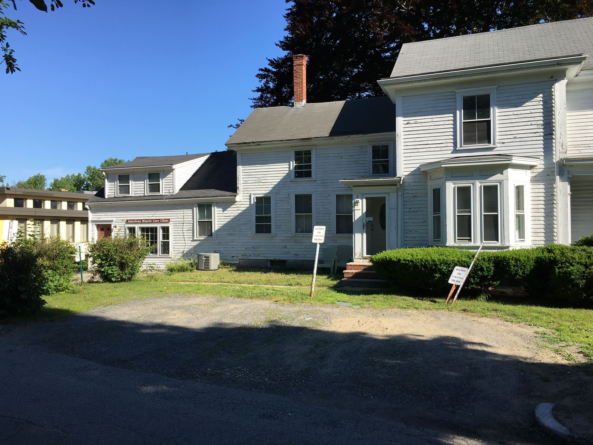 A row of houses on the side of a road.